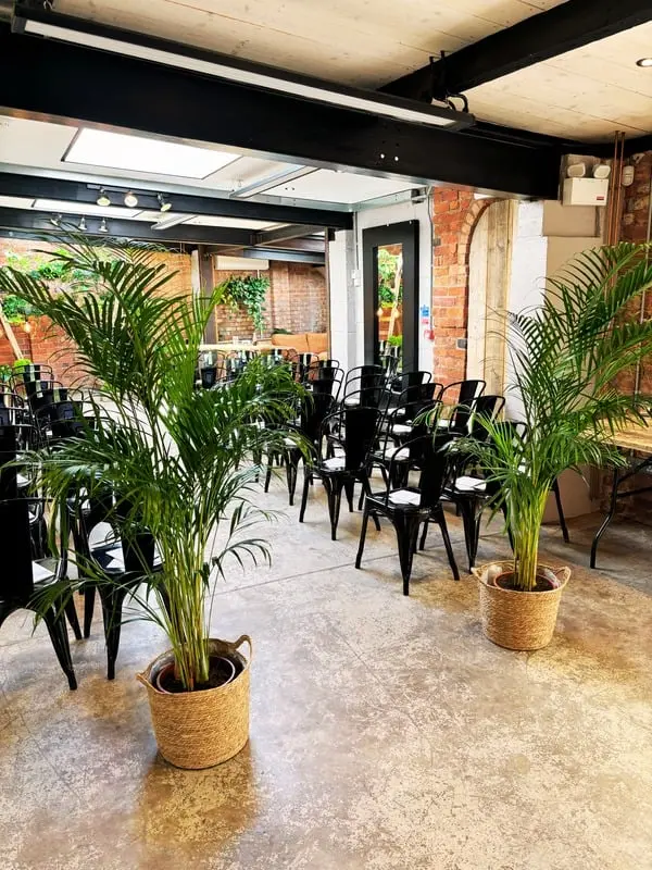 Indoor Wedding Ceremony Styling with Palms and Greenery