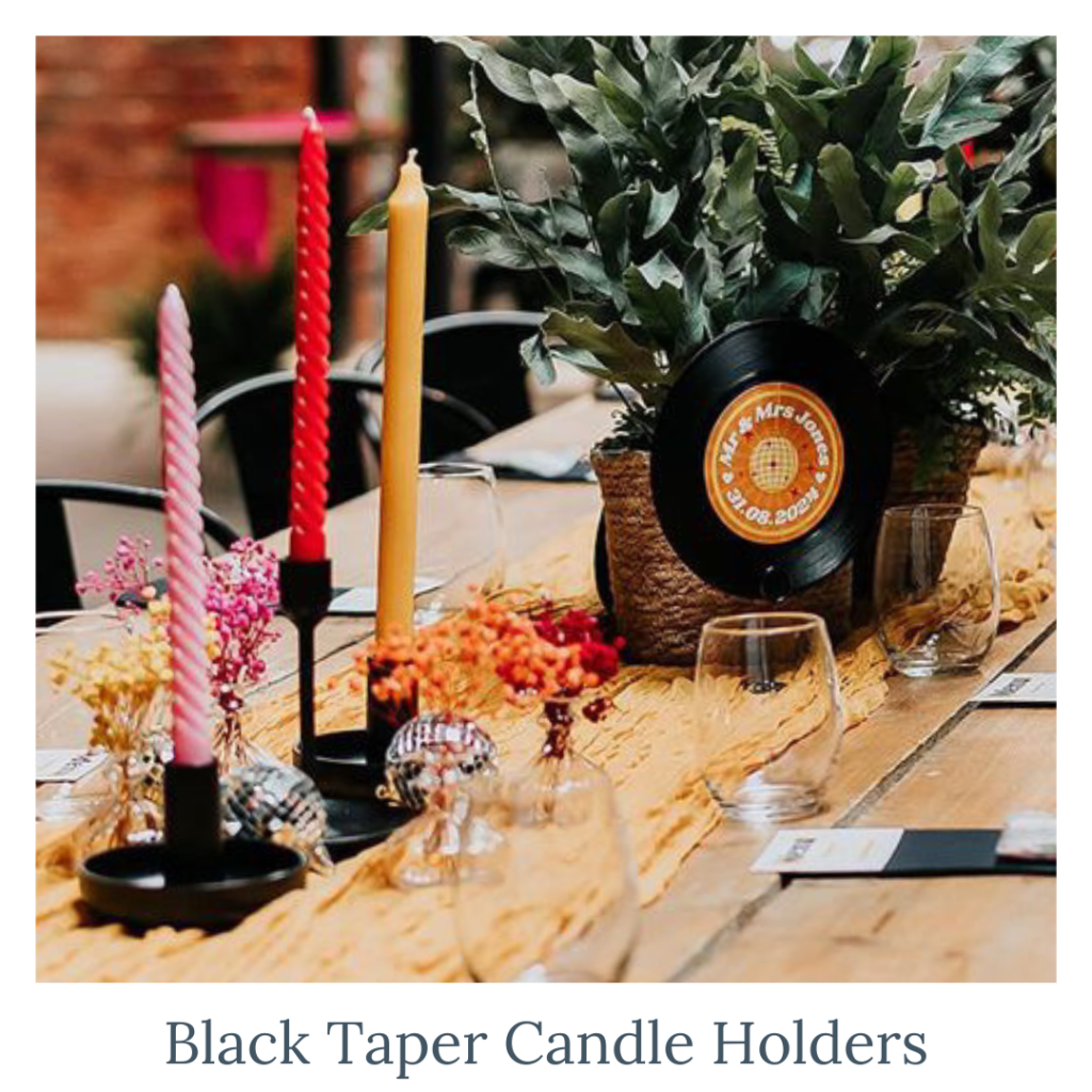 Black taper candle holders with colourful candles for modern wedding table décor