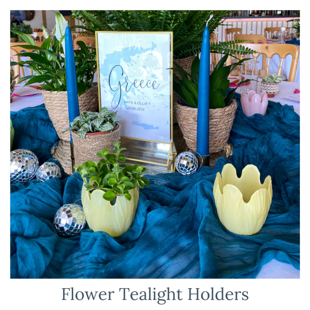 Flower tealight holders with greenery and candles for wedding table décor